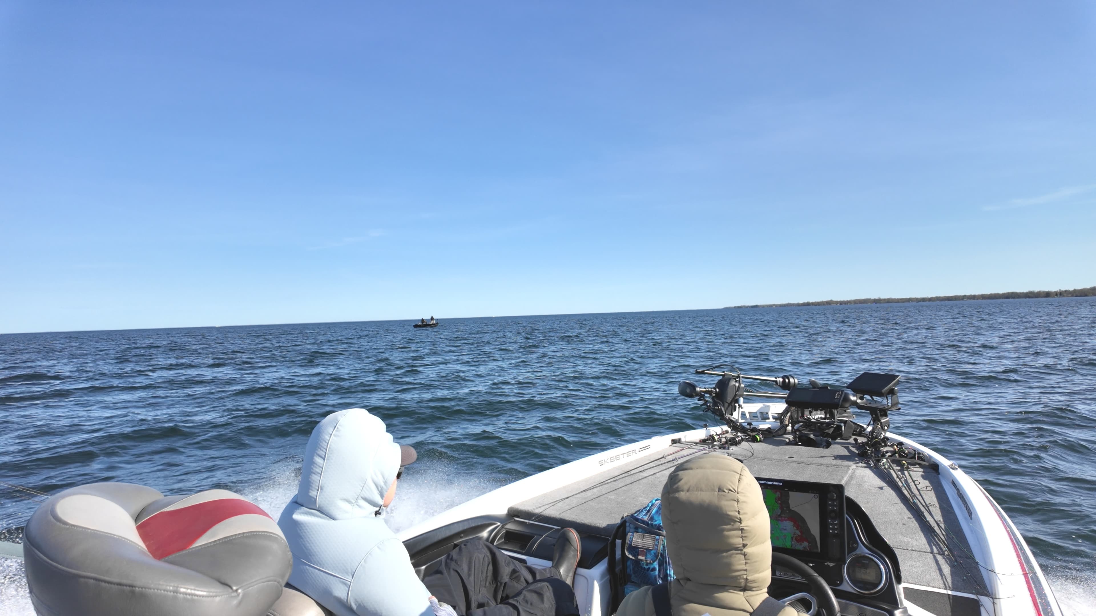 Bass boat running through wave chop