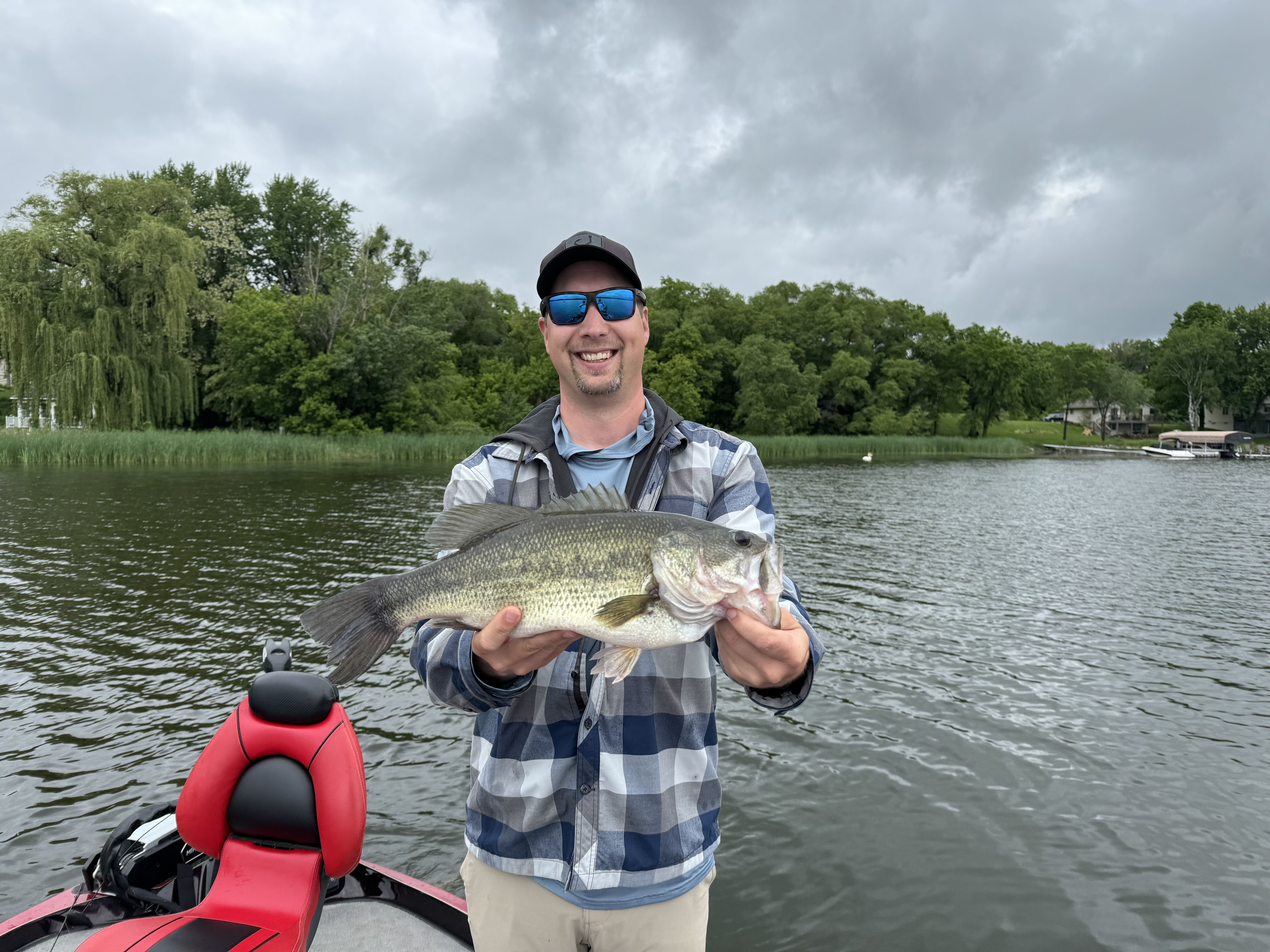 Excited angler holding a largemouth bass